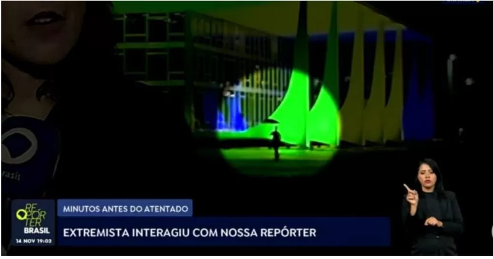 Francisco Wanderley Luiz aparece ao fundo da imagem, após interagir com a repórter Manuela Castro. Foto: Reprodução/TV Brasil